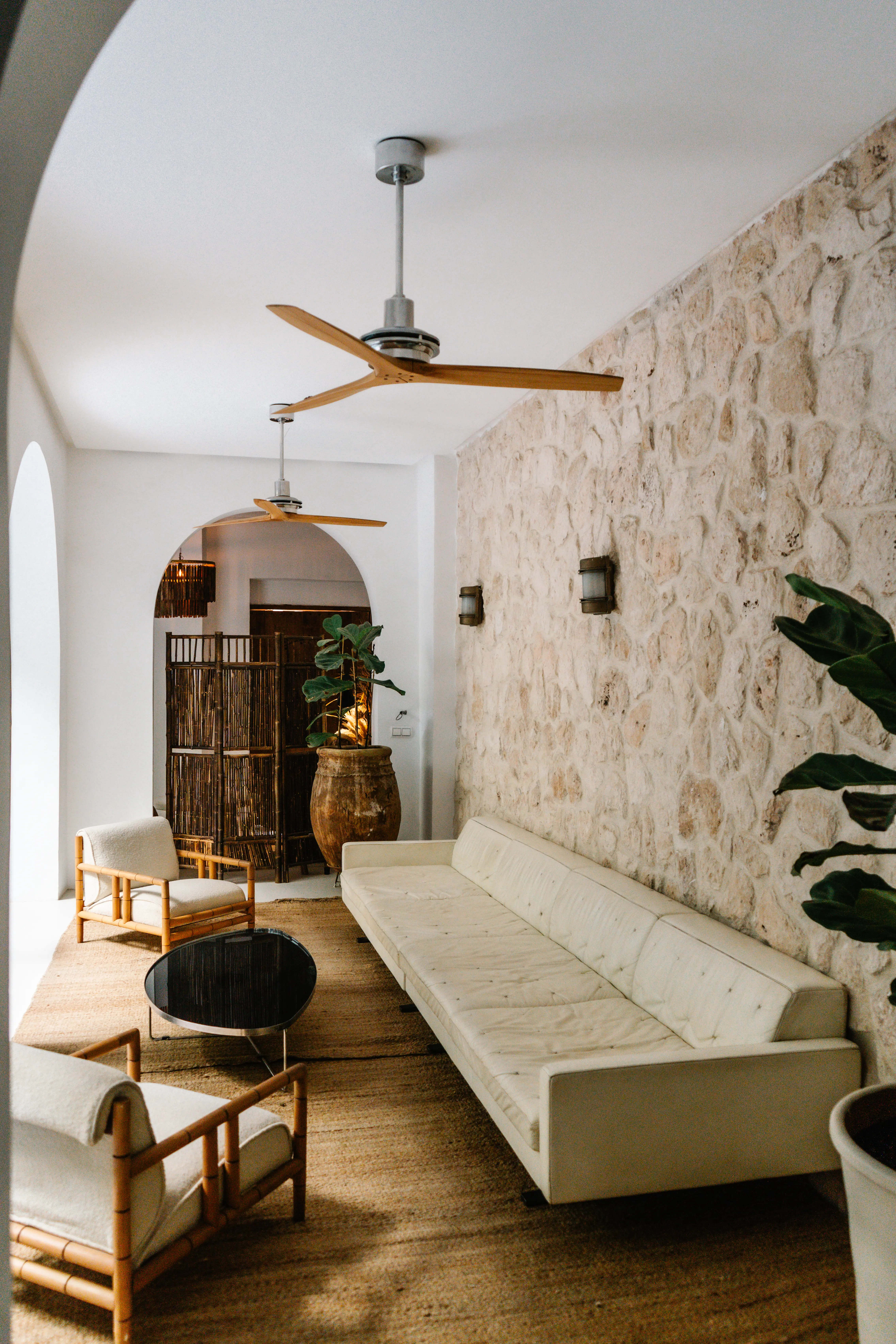 Refined lounge area and stunning staircase design at Pure House, offering a quiet space for relaxation and authentic Moroccan hospitality.